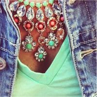 Love the statement necklaces with mint t-shirts