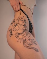 Fineline flower wirh snake tattoo feminine on hips