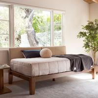 Maximum versatility, minimal design. The Daybed was thoughtfully designed and meticulously crafted to turn unexpected spaces into comfortable corners. Includes the frame, extra-strength cushion-coated slats, and three twin-size PillowBoards. | The Daybed in Walnut, Cafe PillowBoard | Thuma