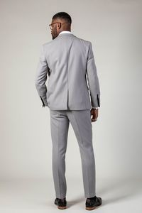 Step up your suit game with this timeless light grey two piece suit. The plain neutral colour is the perfect fit for any occasion, and with added elastane, you'll be comfortable from morning to night. Model wears size 38R blazer & 32R trousers. Features Slim fit Single-breasted Notch lapel Single back vent Four button cuff Two button blazer fastening Complimentary pocket square Waistcoat adjuster straps Functional inside and outside pockets to the blazer Style Tip | Create contrast by wearing wi