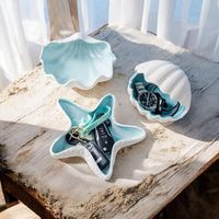 ❖Add a touch of coastal elegance to your home with these ceramic trinket dishes. Featuring a seashell, a large starfish, and a small starfish, these charming dishes are perfect for storing jewelry, keys, or other small treasures. The soft blue interior adds a pop of color, while the textured white exterior mimics the natural beauty of seashells and starfish.❖ * Ceramic trinket dishes * Colors: White exterior with light blue interior * Material: High-quality, durable ceramic * Versatile design fo