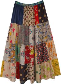 A multi print patchwork full maxi length cotton skirt in deep beige tone with an elastic waist and drawstring.  The unique floral and abstract prints make it a sustainable ethical choice that you can add to your skirt collection. #tlb #Patchwork #MaxiSkirt #Floral #Printed #bohemianfashion #Handmade #PatchworkSkirt #BohemianSkirt #HippieSkirt #MaxiPatchworkSkirt