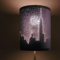 poke small holes in a dark lampshade to make a picture. Nice with a city sky line