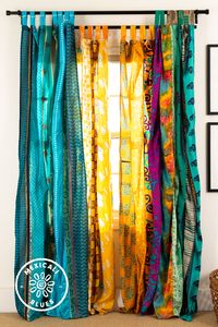 Add color and a calm glow to any space! Handmade by artisans in India, these repurposed silk curtains have lived countless lives as textiles in the form of silk sari skirts worn by Indian women before being upcycled into colorful curtains. These recycled silk curtains are the perfect addition to any boho bedroom, camper van, cabin, boat, dining room, home, office, yoga studio, yurt, or treehouse!