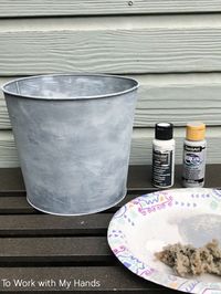 I love a great faux finish! They're usually a lot easier than you'd think and they produce results that are often hard to distinguish from the real thing.They're usually a lot less expensive too. Here's how I transformed a 50 cent thrift store pail into a French-style flower bucket similar to one I found at Wayfair for over $50! I found this pail at a thrift store a long time ago. #fauxpainting #galvanized #buckets