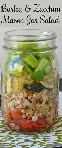 Need a new lunch idea? This jar salad is not only delicious, but healthy too! Packed full of veggies including bell pepper, zucchini and tomatoes! Barley and Zucchini Mason Jar Salad Recipe from Hot Eats and Cool Reads