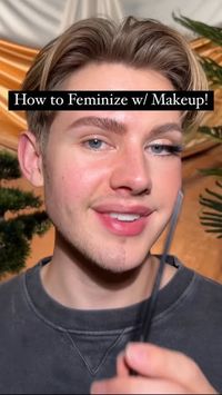 Trevor Barrett on Instagram: "Here’s How to Feminize/Soften your look through makeup!💄Save this for later😊These tips will look good on everyone!🩷🩵I am not attempting to fool or convince anyone anything, these are just general application methods I believe compliment & encourage a feminine look! 

Products: 
@Hudabeauty Peach Color Corrector + Pink Powder + Faux Filter Concealer 
@hauslabs Foundation in 075 
@toofaced Chocolate cream bronzer 
@danessamyricks Blush balm 
@doseofcolors Shimmer Stick 
@lillylashes Half Lashes 
@fentybeauty Hella Thic Mascara 
@YSLbeauty Shine Lipstick 
#makeuptutorial #makeuphacks  #feminize #drag"