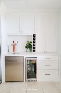 A custom pantry with a built-in freezer, beverage fridge, dual tap kegerator, and lots of storage is the perfect solution in this space off the mudroom.