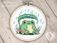 A sweet little frog cross stitch pattern that's adorably whimsical with a touch of cottage core. This fun and simple pattern is perfect for beginners, or if you need a quick project for a gift! This little froggie is shown sitting in a grove of mushrooms, happily taking shelter from the rain under a leaf. **DIGITAL PATTERN DOWNLOAD ONLY. NOT FINISHED PROJECT. DOES NOT INCLUDE MATERIALS** Recommended Fabric: 14 Count Aida Cloth Recommended Hoop Size: 4 inch round Floss: DMC 7 Colours (1 skein eac