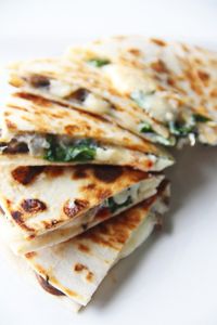 Spinach, sundried tomato, mushroom and goat cheese quesadillas.