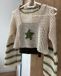 Make a statement with these bold crochet ponchos, perfect for layering and adding flair to your outfit.