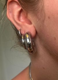 Get ready to twist up your style with Jaxon hoops, a fun and fresh take on classic chubby hoops. These chunky yet lightweight hoops feature a natural "J" curve and are available in both gold and silver. Perfect for daily wear and hypoallergenic too!