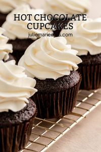 These hot chocolate cupcakes are so festive and delicious. These rich and moist chocolate cupcake are filled with a delicious hot fudge sauce and topped with a silky vanilla buttercream. They are decorated with cute mini marshmallows and a candy can sticks.