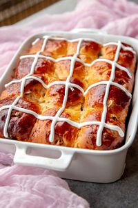 These Hot Cross Buns are made with an enriched dough that’s lightly sweetened and soft as a cloud. Filled with plump dried berries and chocolate it’s sure to impress your tastebuds and family! Also, check out my recipe for Easter Bread and Brioche Dough. These Hot Cross Buns use a well-enriched dough with eggs and...