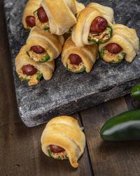 If jalapeño poppers and pigs in a blanket had a baby you would get these smoked jalapeño poppers pigs in a blanket! These cheese and bacon filled jalapenos, stuffed with a little smokie, wrapped in golden brown crescent dough, are hard to beat!