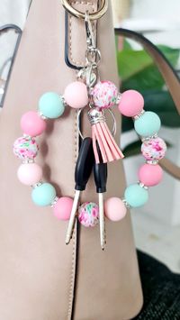 Handmade🖐️  These handmade silicone bead wristlets are a must-have accessory for your keys.  You can attach your keys to the wristlet, and put it on your bag, making finding your keys so much easier,(and it's beautiful bag charm)or this is perfect when you are going out without a bag or you don't have any pockets to put your keys in.  Wristlets are very durable and lightweight.  These are perfect gift idea for your friend,coworker,teacher,mother,your kids..everybody will enjoy this.