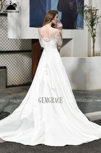 Ivory Satin Wedding Dress Illusion Neck Half Lace Sleeves With Train Ref#EZ32387 at GemGrace. #WeddingDresseswithSleeves Shop now to get $10 off. Pro custom-made service for wedding dress, formal dress. View Wedding Dresses with Sleeves for more ideas. Click to shop now! #BuyableWeddingDresseswithSleeves