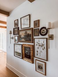 Discover the charm of a curated vintage gallery wall, featuring handpicked antique artwork and timeless pieces. Perfect for adding character and history to any room, this gallery wall is a blend of nostalgia and elegance. Get inspired to create your own vintage-inspired art display, ideal for those who love unique home décor ideas. Explore how to mix and match frames, art styles, and vintage finds to craft a personalized gallery wall that tells a story.  Gallery Wall for my home created by Evan Gray Design