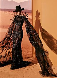 Long back tulle dress with theatrical open sleeves and fully beaded in three-dimensional white pearls. Dancing feathers around the shoulders.

#TonyWard #FW24 #RTW #FallWinter #SafariSunset