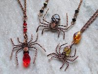 spooky season spider chokers/necklaces crafted with antiqued copper wire, glass and gemstone beads✨ choose your favourite and your desired chain length 🖤 red- glass (no gemstone, pendant style)  golden- citrine & glass (pendant style)  black- snowflake obsidian & glass (choker style)