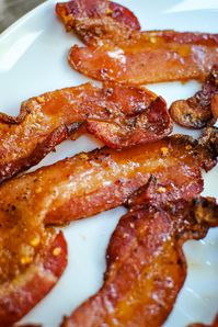 Snoop Dogg's Billionaire's Bacon is covered in brown sugar, red pepper flakes, and black pepper you will have this recipe on repeat!