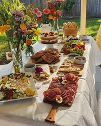 Evening garden dinner with charcuterie board variety