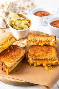 Everyone loves a good grilled cheese sandwich. What if we told you that you could make them in the air fryer?! This Air Fryer Grilled Cheese recipe is the easiest way to make this classic sandwich. It's ready in 10 minutes and comes out perfectly toasted with melted gooey cheese every time.