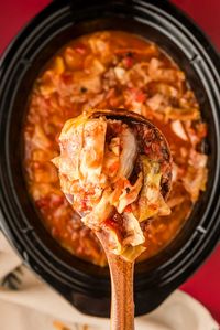 Slow Cooker Cabbage Roll Soup! This easy slow cooker cabbage roll soup gives you all the flavor of a cabbage roll but for a fraction of the effort. Just fill the pot, let it simmer, and eat! | HomemadeHooplah.com