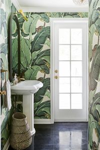 proof that all bathrooms should be layered in banana leaf wallpaper