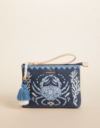 A beautiful sea life scene with crab embroidery is just the beginning to our thick, durable cotton and jute Carina Wristlet, which features a faux leather wristlet strap, an easy, zip-top opening, a tiered tassel, plus an interior zip pocket.