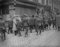 June 1922: Irish Free State soldiers patrolling the streets of Dublin during the Siege of the Four Courts, the headquarters of the anti-Treaty Republicans during the Irish Civil War. (Photo by Walshe/Topical Press Agency/Getty Images)