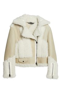 Plush lamb fur softens the hard-driving moto aesthetic of this biker jacket crafted of genuine shearling in a patchwork motif. 23 1/2" length (size 12 US / 46 IT) Asymmetric zip closure Notched lapels Zip cuffs Front welt pockets Genuine shearling (Spain) Professional fur clean Made in Italy Women's Designer Clothing