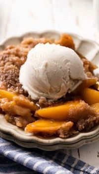 In this delicious peach crumble recipe, fresh peaches are infused with cinnamon and vanilla and topped with a sweet buttery crumble topping. This easy peach crumble is made with 8 ingredients, and is best served warm with vanilla ice cream, of course.