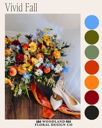 Vivid fall wedding floral color palette: oranges, blues, greens, terracotta, rust. Fall wedding at Hazelwood Weddings in New Oxford PA. Wedding floral designer Woodland Floral Design Co. Wedding photographer Kylee B Photography. Bridal bouquet, wedding arch, centerpiece, bridesmaid bouquet inspiration.