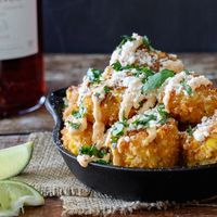 A fun and creative tapas recipe for Mexican Street Corn Croquettes. All the flavor of Elotes (Mexican Street Corn) in bite-size form!