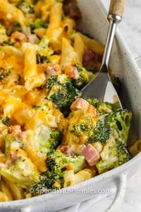 This tasty broccoli and cheese casserole is easy to make in the oven for a busy weeknight. Just assemble and bake the ingredients as directed. #spendwithpennies #broccolicasserole #entree #sidedish #recipe #casserole #ham #cheesy #simple #easy #best #cheese