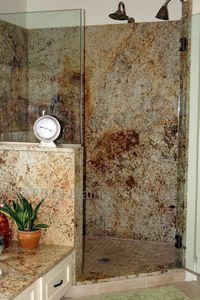 Colonial Gold Granite shower. Natural Travertine Floor