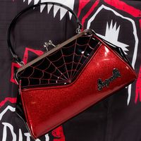 Our Spiderweb Backseat Baby Purse has the most gorgeous, red glitter vinyl you ever did see! Complemented by red spiderweb embroidery, it's a must have handbag - day or night, Spring or Fall! A classic Sourpuss handbag, it features a sturdy, vintage shape, satin lining, kiss-lock closure and easy grip handles. Great for toting around at car shows or for a night out on the town! Made by Sourpuss Measures approx. 13.5" H x 8" W x 4.5" D Vinyl Body, Satin Lining Vegan Friendly Sourpuss Hardware Pro