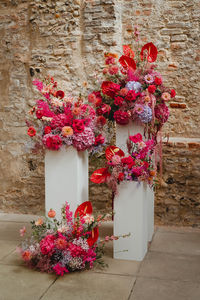 Beautiful modern red, pink and purple hue ceremony floral plinths by Floral Sistas in Norfolk. Photo by Georgia Rachael Photography.