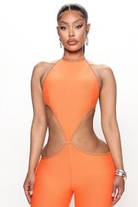 Available In Black And Orange. Bandage Jumpsuit Halter High Neck Embellished Detail Side Cut Outs Legging Invisible Back Zipper Stretch 90% Polyester 10% Spandex Imported California Proposition 65 WARNING: Cancer and Reproductive Harm - www.P65Warnings.ca.gov. | Baddest Bandage Jumpsuit in Orange size XS by Fashion Nova