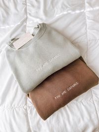 mini embroidery is finally here! item will ship 1-2 weeks after purchase :) a crewneck with positive affirmations to remind yourself + others how capable + worthy we all are. the smiley face on the sleeve to spread happiness + comfort even if we're anxious or afraid of what's to come. the sizing is unisex and the fabric contents are 50% Cotton; 50% Polyester front only is embroidered. heat pressed + designed by me. please wash inside out + air dry.