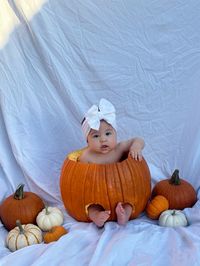 Cute baby milestone setup for fall. Baby in pumpkin photoshoot pose setup for instagram