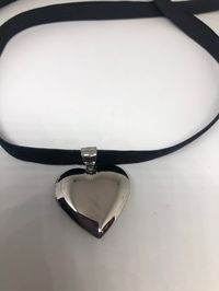 Vintage heart Locket Choker Silver stainless steel Deco Etched Necklace Lovely vintage Stainless steel silver locket Heart etched frame About an inch long Hangs on a long velvet ribbon Can hang on a chain All jewelry is shipped free in the US in a nice gift box. Check out our over a THOUSAND great reviews