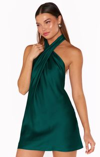 Our bestselling halter maxi is now in mini length! This emerald mini is cut on the bias to give that perfect slip draping we're all looking for. The top softly wraps around your neck for a flattering high neck and leaves a dramatic open back. A new go-to for special occasions and events! STYLE TIP: Twist right over left to allow halter neck to sit correctly.