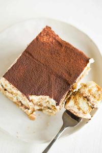 Learn how to make this classic tiramisu recipe! Layers of mascarpone custard, espresso and Kahlua-soaked ladyfingers, and cocoa powder make up this traditional Italian dessert. It's a not-too-sweet treat perfect for any occasion! Made without raw eggs, this creamy tiramisu is a delicious dessert you can feel good about dishing out anytime! It's a no-bake dessert perfect for when you don't want to turn on the oven. You can even make this tiramisu without alcohol if you want.