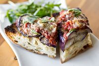 This grilled eggplant parmesan features marinated, grilled eggplant, marinara, and parmesan cheese all atop of garlicky, rustic ciabatta!