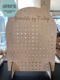 "Table Top Curved Pegboard Display Stand/ Collapsible Display/ Market Display/ Curved Top Display SVG (DIGITAL FILE only) **IMPORTANT** Please note that NOTHING will be mailed to you. This is a DIGITAL CUT FILE for those who have a laser machine (Glowforge, Thunder, Mira, Omtech, etc.) This is NOT something you will receive in the mail** Cut File Design: Curved Table Top Pegboard Display You will receive: (1) SVG Files Measured for 1/4\" Baltic Birch Plywood. Peg holes are sized for standard US Pegboard Pegs and 1/4\" wooden dowels. Dowels/pegs are not included and will need to be purchased separately.  IF THESE ARE NOT WHAT YOU ARE USING, YOU WILL NEED TO ADJUST SLOTS TO FIT THE MATERIALS YOU CHOOSE. Finished product measures approx. 18\" tall x 13.25\" wide.  Design is intended to be abl