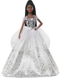 PRICES MAY VARY. 2021 Holiday Barbie doll reflects the magic of the season in a gorgeous gown, sparkling with sophisticated glamour. Her elegant floor-length dress features off-the-shoulder ruched sleeves and a metallic bodice with dazzling sculpted "gemstones." Accented with a tulle peplum and silvery accents, her full skirt sparkles from every angle. Silvery "pearl" earrings, sparkling eye makeup and bold red lips complete her dazzling look. Barbie doll's long, braided hair is styled in a chic