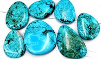 PRICES MAY VARY. turquoise pendant,freeform,focal Material:natural stone ,the color have enchanced  Quantity:4pcs  Size :25-50mm