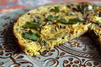 This egg-less frittata gets mixed, poured, and baked until crispy. Filled with veggies it's the ultimate vegan breakfast. | Plant-Based on a Budget 